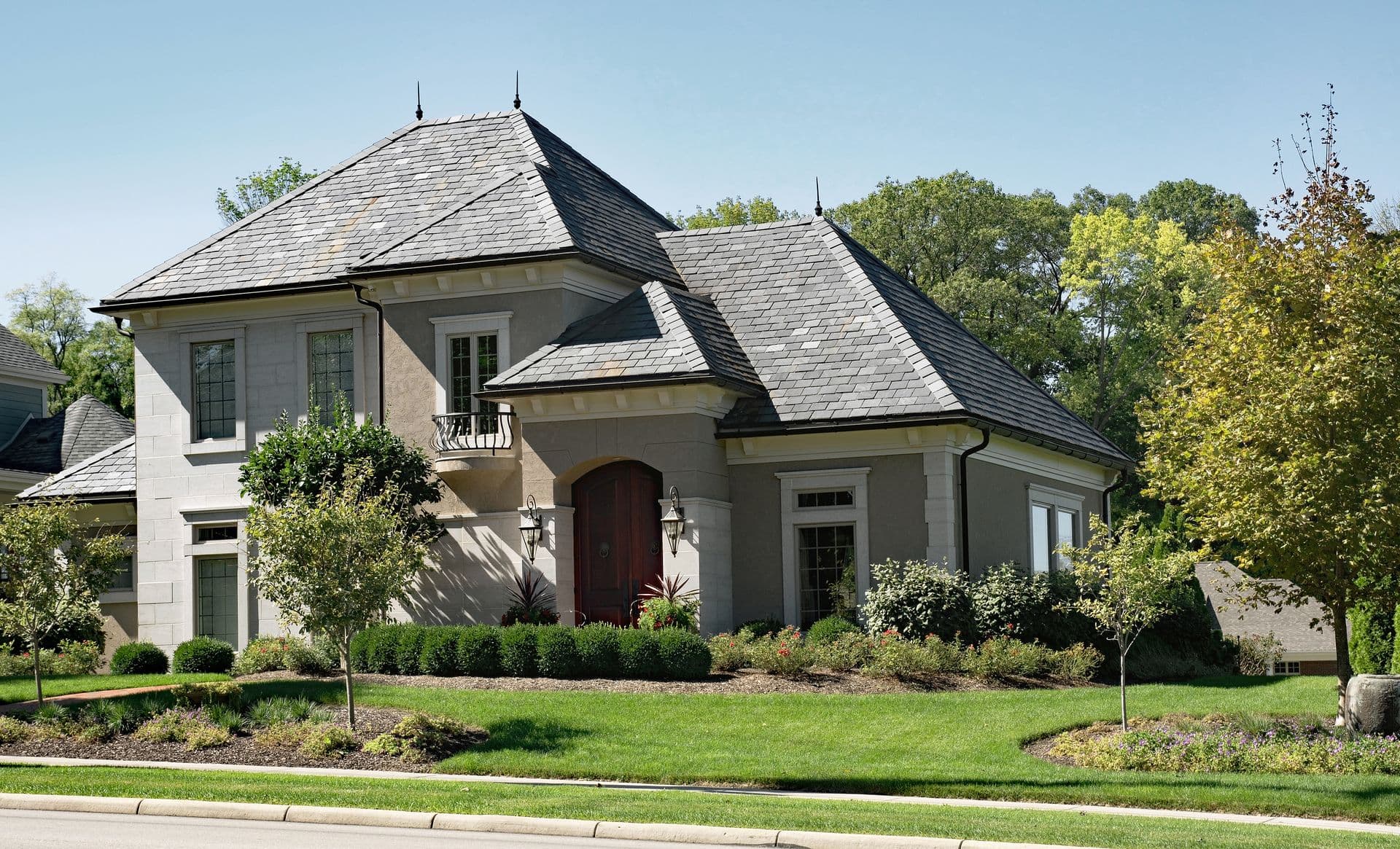 bigstock-Stone--Stucco-House-with-Slat-146711717 (2).jpg